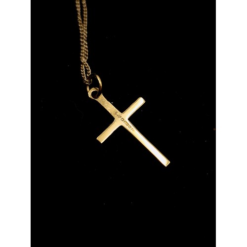 540 - A nine carat gold cross (375) together with a nine carat gold chain. Length - 42 cms. Total weight -... 