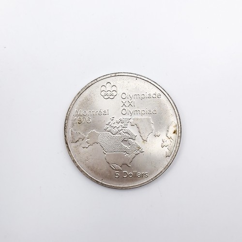 545 - A Sterling Silver Montreal 1976 Olympiad five dollar commemorative coin. Comes in original case.