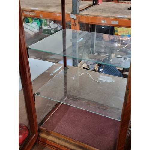 390 - A handsome Edwardian oak glass fronted display case with mounted brass name plaque to front. We have... 