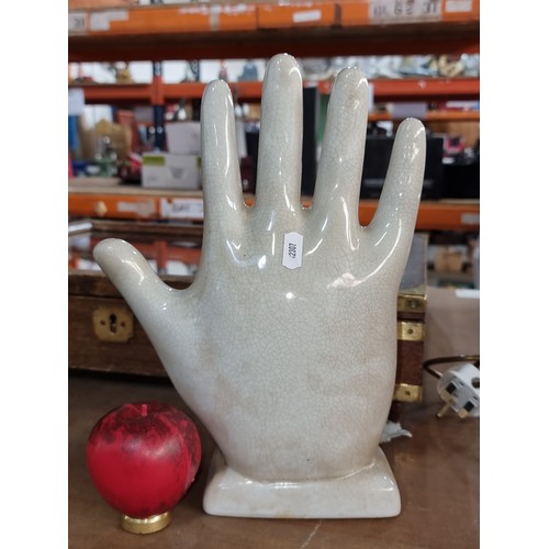 197 - A large ceramic decorative Palmistry hand. In good condition.