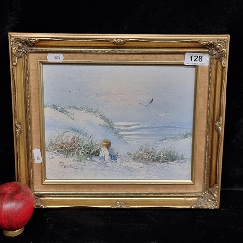 128 - A lovely original oil on canvas painting featuring a child seated amongst some sand dunes on a beach... 