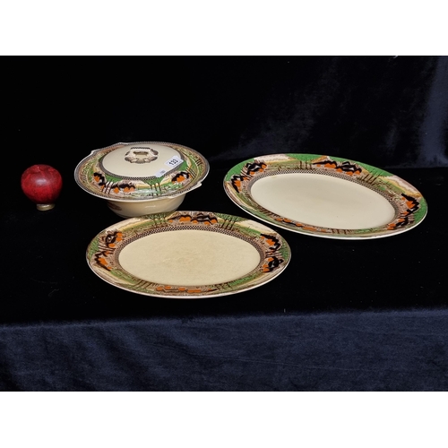 133 - Three pieces of Myott Son & Co Studio pottery including two serving plates and a lidded soup tureen.... 