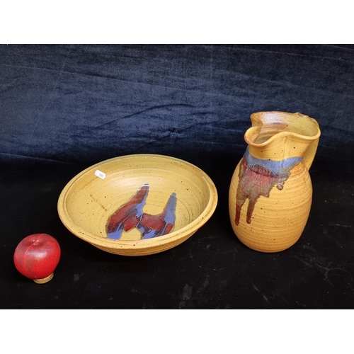 140 - A pair of Badger Hill Studio Pottery pieces including a jug and bowl. Both in good condition with st... 