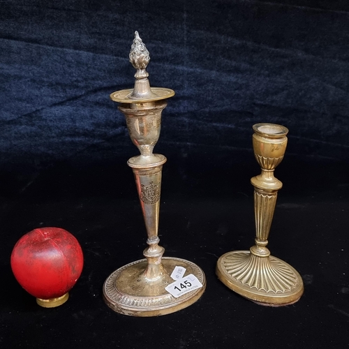 145 - Two antique candlesticks. Both feature intricately engraved details, with taller example complete wi... 