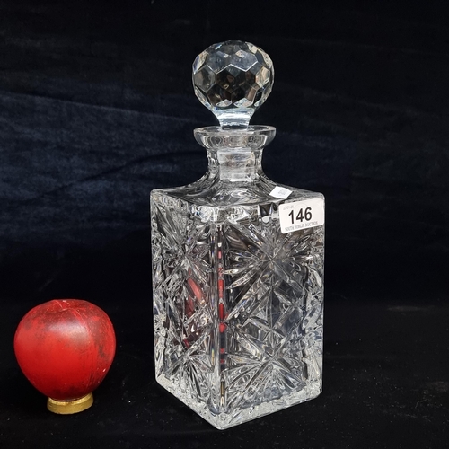 146 - A fabulous, heavy cut glass decanter complete with original stopper.