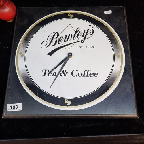 188 - A square wooden wall clock printed with 'Bewley's Tea & Coffee'. Battery operated.