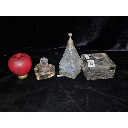 230 - Three cut glass items including two inkwells and a perfume bottle.