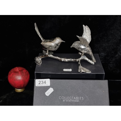 234 - A Debenhams Collectables chrome figure of two birds perched upon a branch.