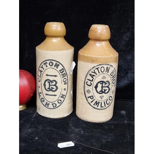 242 - A pair of stoneware Clayton Bros Pimlico ginger beer bottles.