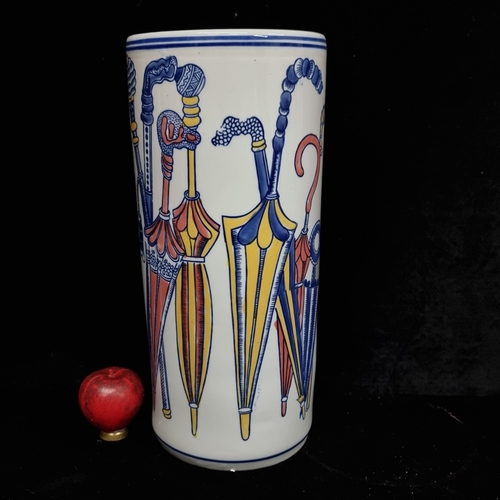 267 - A very pretty Ceramic umbrella stand. Features umbrella patterns in shades of blues, pinks and yello... 