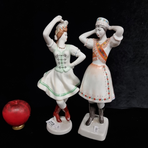 273 - A charming pair of Hollohaza Hungarian dancing girl porcelain figurines. Both featuring fine hand pa... 