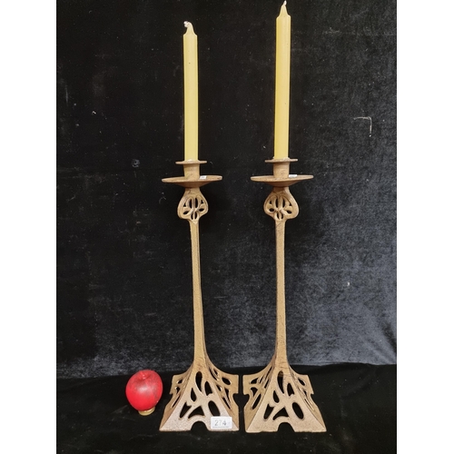 274 - A wonderfully elegant pair of tall cast iron candlesticks in Art Nouveau style.