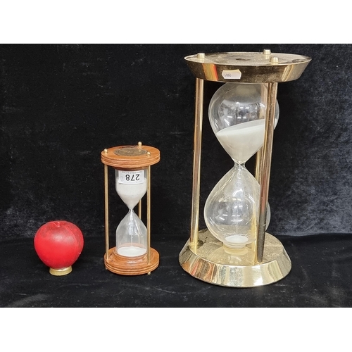 278 - Two sand timer watches including a large polished brass example and a vintage turned wood and brass ... 