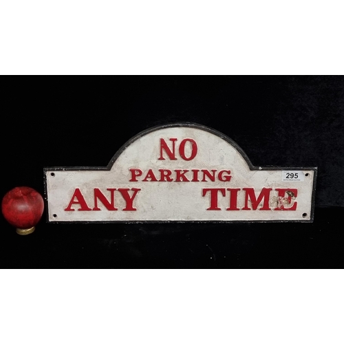 295 - A cast metal wall plaque reading 'No parking any time'.