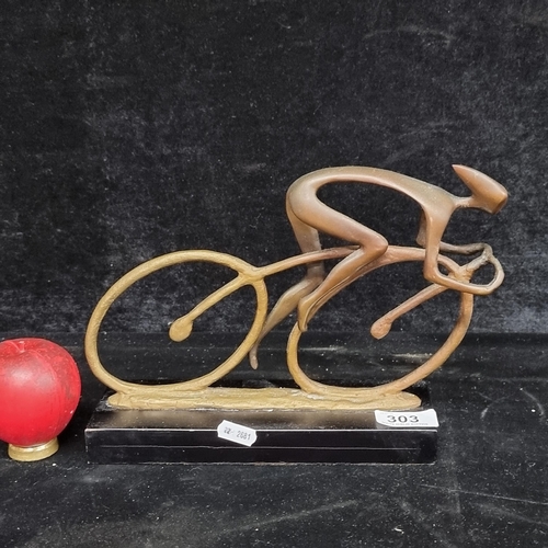 303 - Star lot : A vintage forged metal and bronze sculptural piece of a cyclist, mounted on a plinth base... 