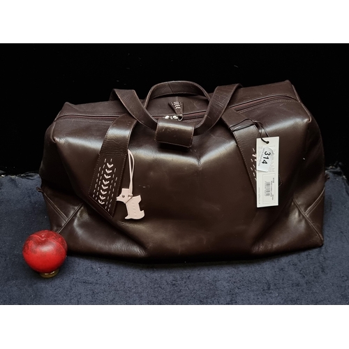 314 - Star Lot: A designer Radley London genuine leather large Holdall in brown. Similar models retail for... 