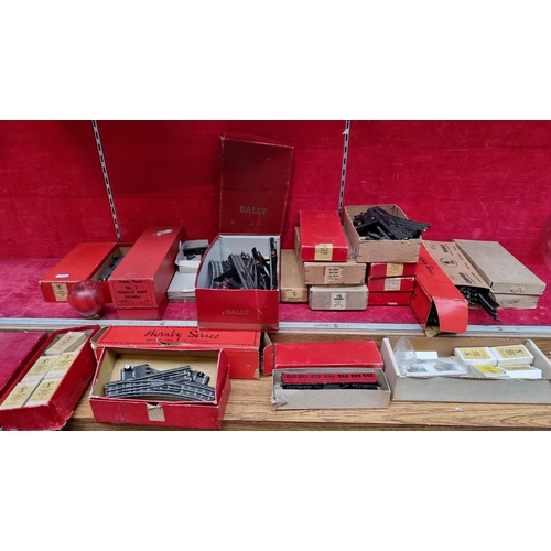 316 - A large collection of vintage Trik Twin Railway and Hornby Trains model railway parts includes track... 