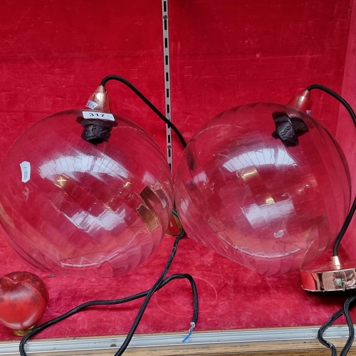 317 - A pair of elegant good size hanging glass orb ceiling lights.