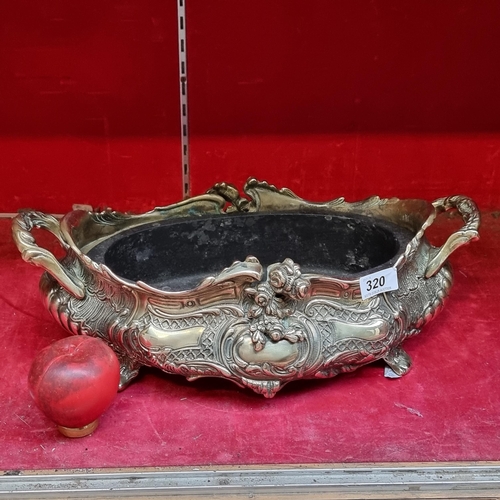 320 - A highly ornate antique large brass French footed planter with handles. Professionally cleaned.