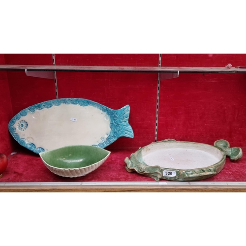 329 - Three fabulous pieces of studio art pottery includes two platters in the form of fish and a shell sh... 