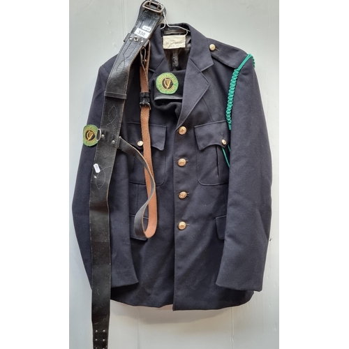 330 - A vintage Irish Civil Defence uniform including a 1984 Mc G Bros jacket size 36L, a pair of trousers... 