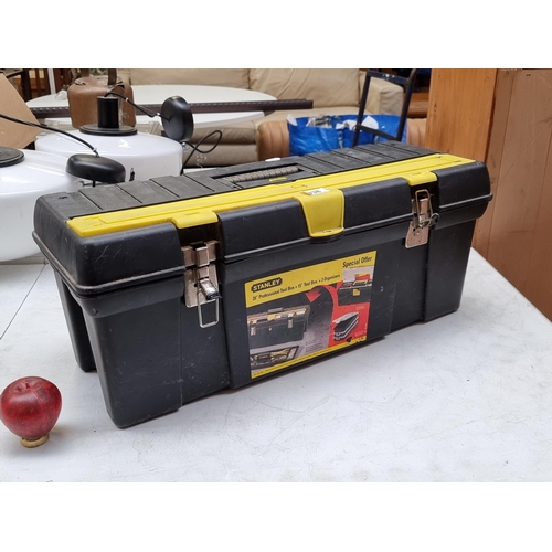 338 - A large Stanley tool box and organizers comprising of various tools.