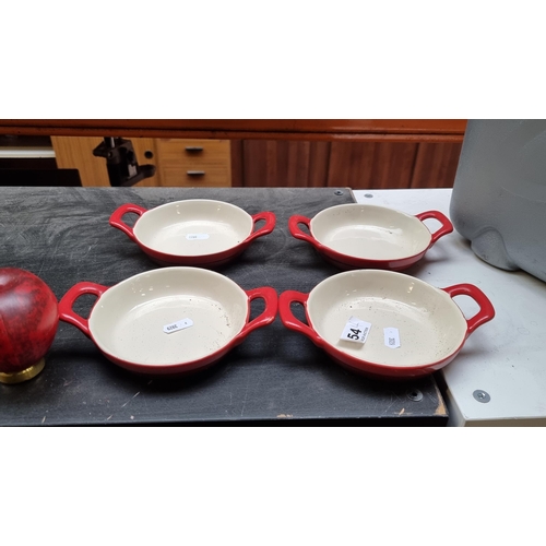 354 - Four Kuhn Rikon Swiss design cookware dishes.