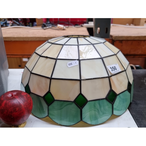 356 - A large Tiffany style lamp shade in beige and green.