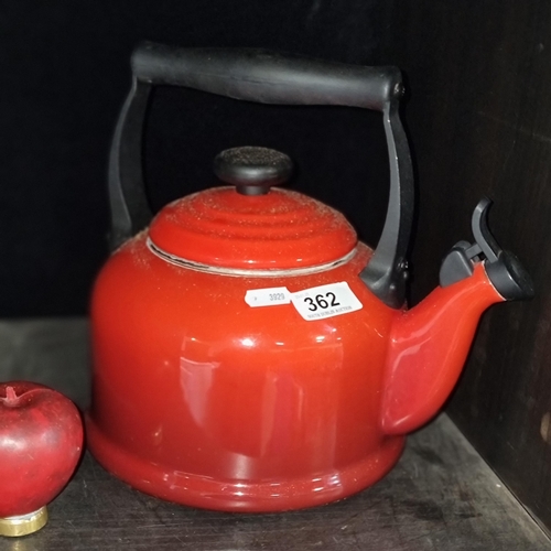 362 - A Le Creuset stove tea pot in cerise red. Similar model retailing for €135 on their website. In very... 