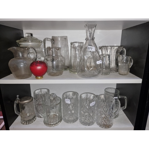 377 - Two full shelves of vintage glass including a gorgeous set of four crystal beer tankards and an attr... 