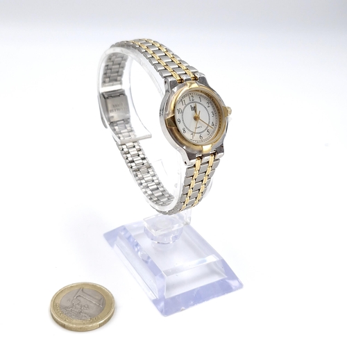 87 - A LIP bi colour ladies quartz wristwatch with matching bezel & bracelet. In good condition.