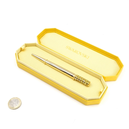 89 - A beautiful Swarovski gold toned ballpoint pen with attractive barrel finish. Comes in original Swar... 