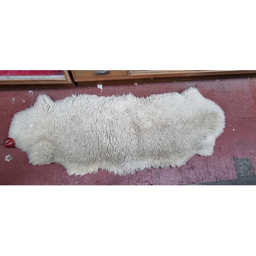 323 - A Genuine sheepskin rug.