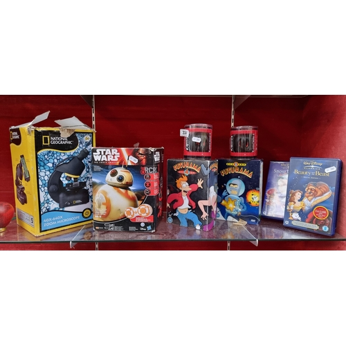 324 - A mixed lot of toys, DVDs and speakers. Includes a special edition DVD of Disney's 'Beauty and the B... 