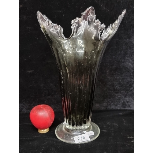 276 - A gorgeous hand blown art glass vase with reeded design. Large Pontil Mark to base.