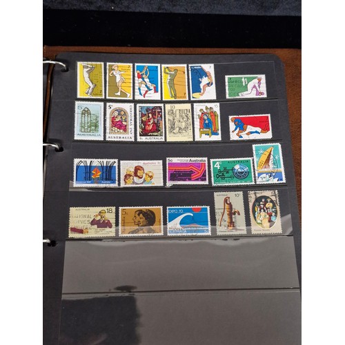 135 - A Royal Mail Universal stamp album containing stamps from Australia, Bangladesh, Canada, Mexico, Sin... 