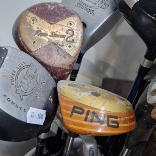 458 - A vintage mixed lot of golf clubs comprising of a driver, woods, irons and wedges from various diffe... 