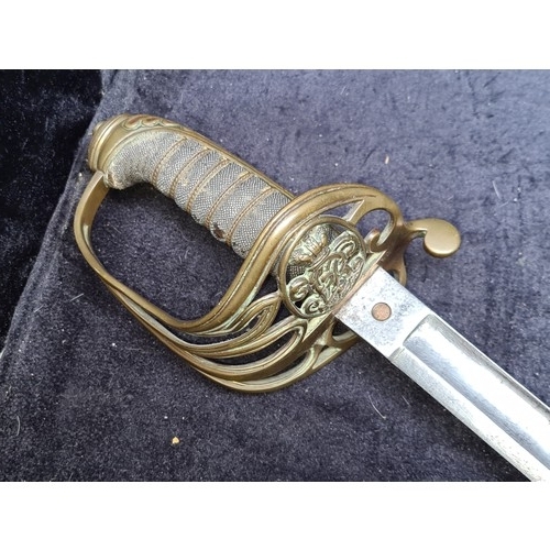 318 - Star Lot: An antique century Infantry Officer's Sword adorned with intricately carved handle. Comple... 