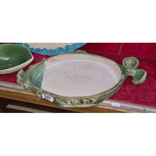 329 - Three fabulous pieces of studio art pottery includes two platters in the form of fish and a shell sh... 