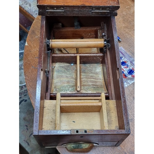 635 - A lovely example of an antique shop counter cash register containing some copper coins.