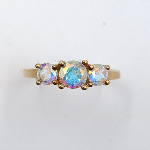 26 - A three stone mystic topaz ring set in nine carat gold (375). Ring size - P 1/2. Weight - 1.48 grams... 