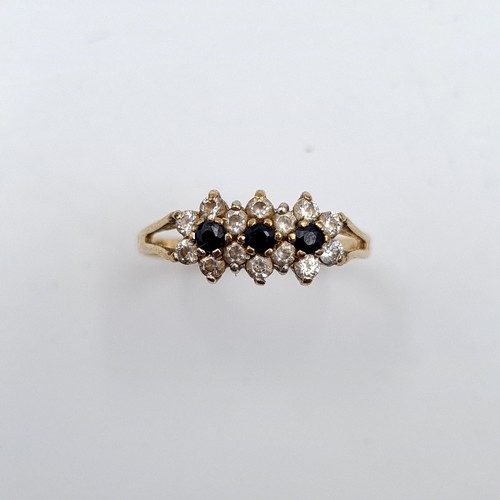 27 - A nine carat gold sapphire & gemset ring. Ring size - P. Weight - 1.58 grams. Boxed.