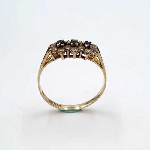 27 - A nine carat gold sapphire & gemset ring. Ring size - P. Weight - 1.58 grams. Boxed.