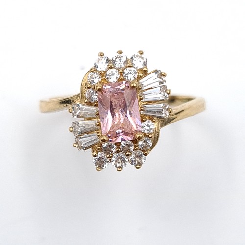 30 - An attractive Pink topaz gem set cluster ring set in nine carat gold. Ring size - N. Weight - 2.29 g... 