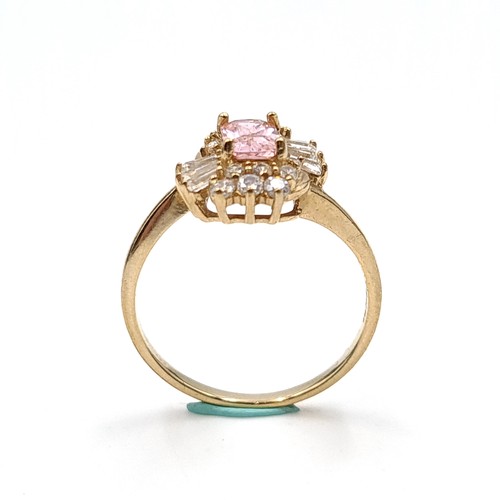 30 - An attractive Pink topaz gem set cluster ring set in nine carat gold. Ring size - N. Weight - 2.29 g... 