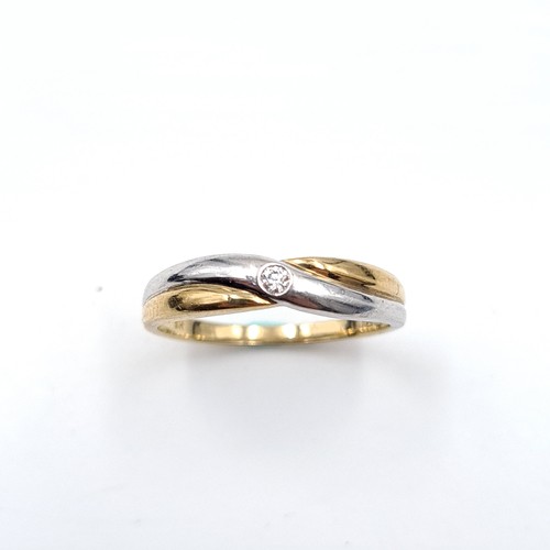 31 - An attractive nine carat gold (375) bi colour ring set with diamonds. Ring size - O. Weight - 1.82 g... 