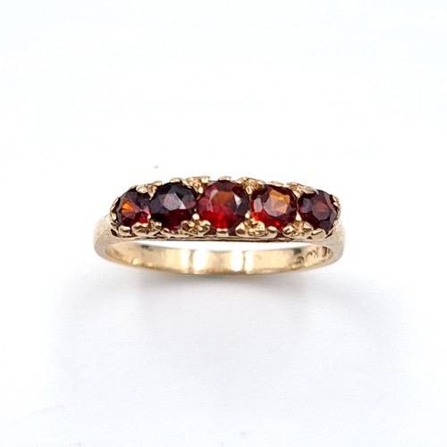 32 - A pretty five stone garnet ring set in nine carat gold (375). Ring size - K. Weight - 1.77 grams. Bo... 