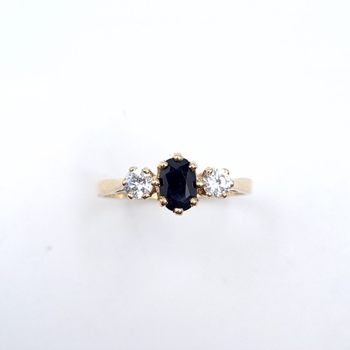 37 - Star Lot : An attractive blue sapphire and gems stone ring set in nine carat gold. Size - O 1/2. Wei... 