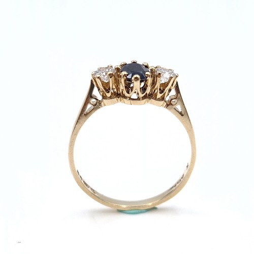 37 - Star Lot : An attractive blue sapphire and gems stone ring set in nine carat gold. Size - O 1/2. Wei... 