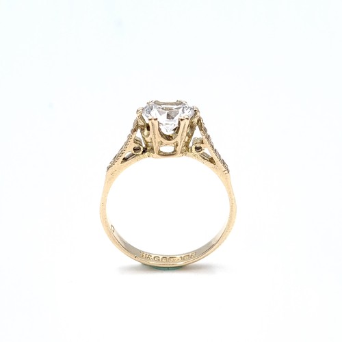 41 - A nine carat gold white topaz crown set ring. Size - J. Weight - 1.9 grams.